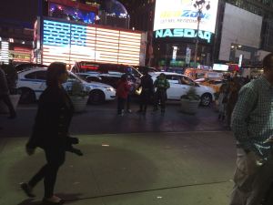 Times Square at night, just a few superheroes hanging around