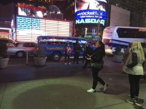 Times Square at night, just a few superheroes hanging around